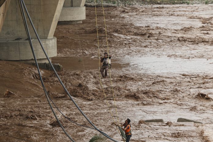 PTI06_25_2025_000048B-696x464 Nine Men Trapped In Swollen Tawi River Rescued In Jammu